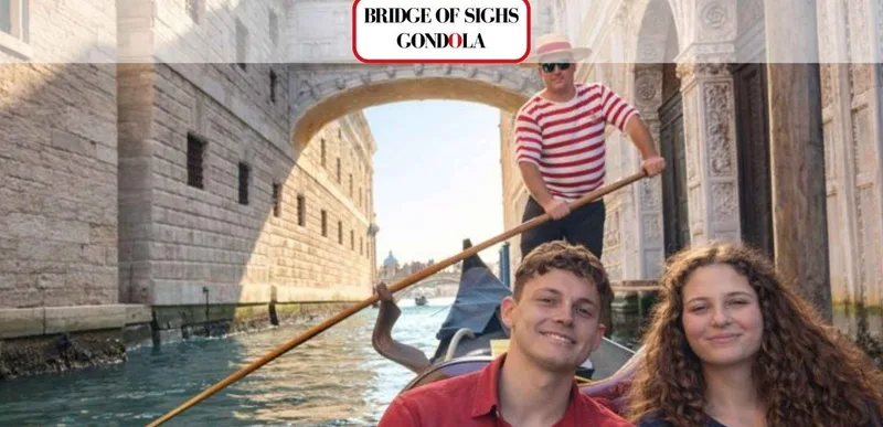Gondola gliding under the white stone Bridge of Sighs on a gondola ride in Venice, Italy, seen from the water below